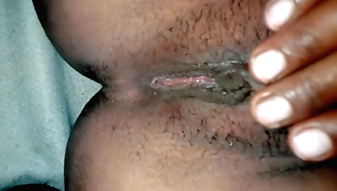 Indian brunette fingers her hairy pussy and masturbates