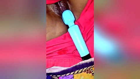 Indian babe in red dress plays with her hairy pussy