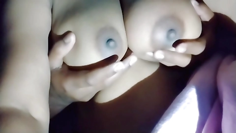 Big boobs massage session in the front of the couch