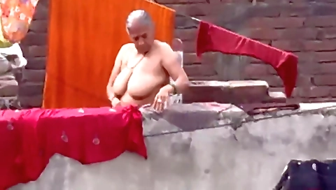 Indian granny with big breasts is shaved on camera