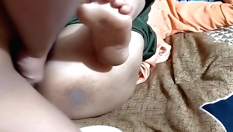 Indian girl with a shaved pussy is playing with a dildo