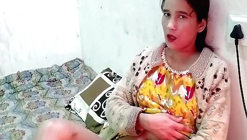 Indian woman with a nice face plays with her vibrator