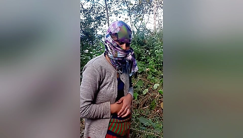 Nepali girl fucks hairy hole outdoors with his hands