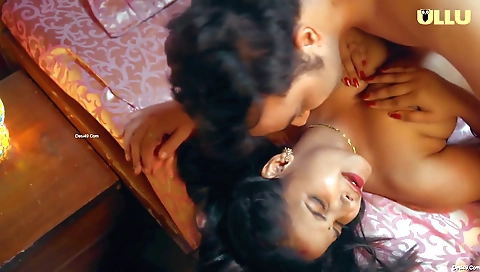 Busty brunette shows off her feet in a foot fetish video