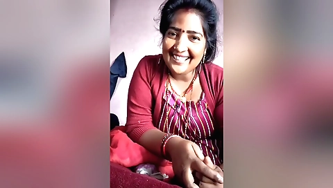 Busty indian woman in the bed gets a friend's hand on her pussy
