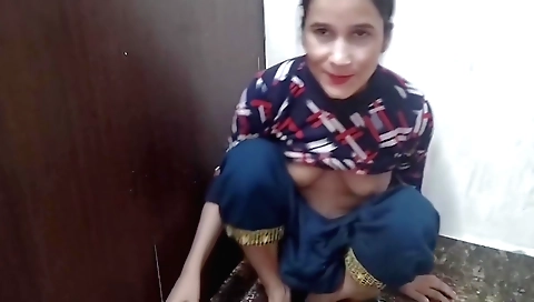 Indian girl in a sexy outfit moves around the room