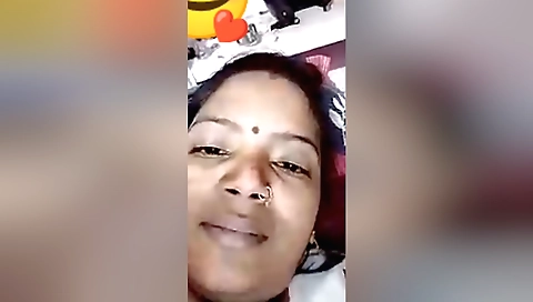 Indian brunette watching video call with boyfriend