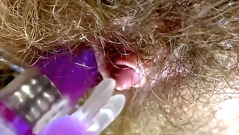 Young old lady plays with her hairy pussy in the bedroom