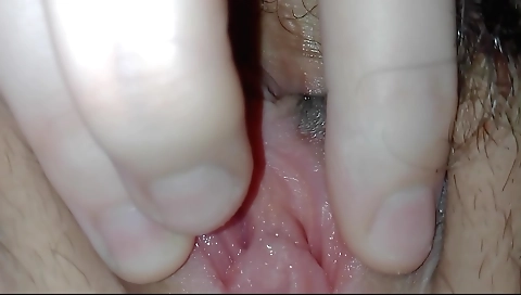 Sexy girl in red lingerie doing her things on a bed