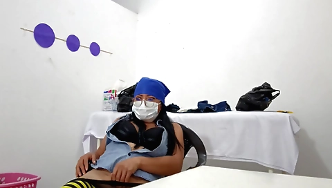 Busty nurse in a white uniform and stockings gives a nice self vid