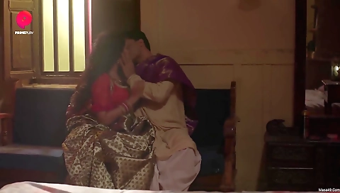 A sexy brunette with big breasts is sucking her pussy