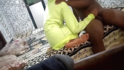 Indian girl in a red dress rides a cock in a bed room