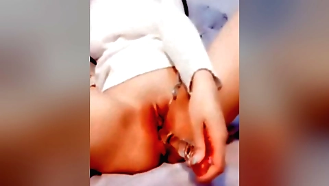 Amateur brunette 18+ girl riding on her pussy dildo