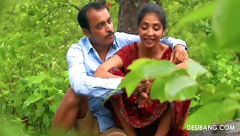 Indian woman rides a bike in the jungle and has sex