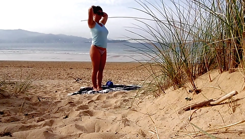 Outdoor solo video showing a sexy brunette with big boobs