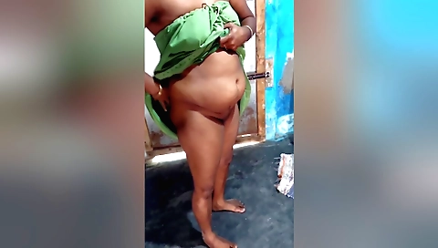 Solo woman playing with her hair and showing her body