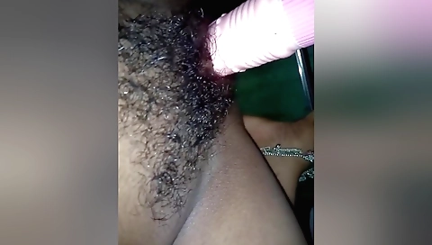 Hindu chick with hairy pussy plays with a white dildo