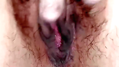 A hairy indian solo female is taking care of her pussy