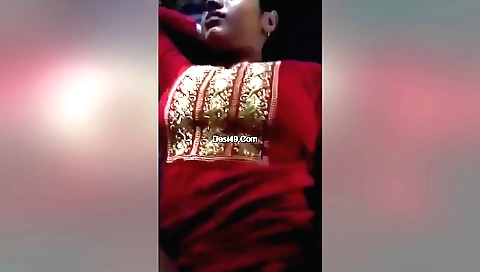 Hairy indian girl is standing on the grass outside