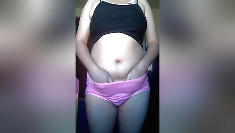 Hot brunette in a sexy outfit masturbates on her laptop