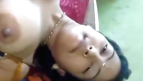 Brunette with large boobs enjoys solo time on the chair