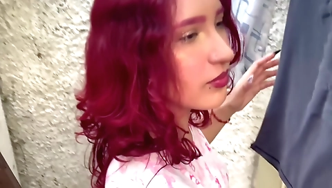 Amateur redhead is in the yard wearing her clothes